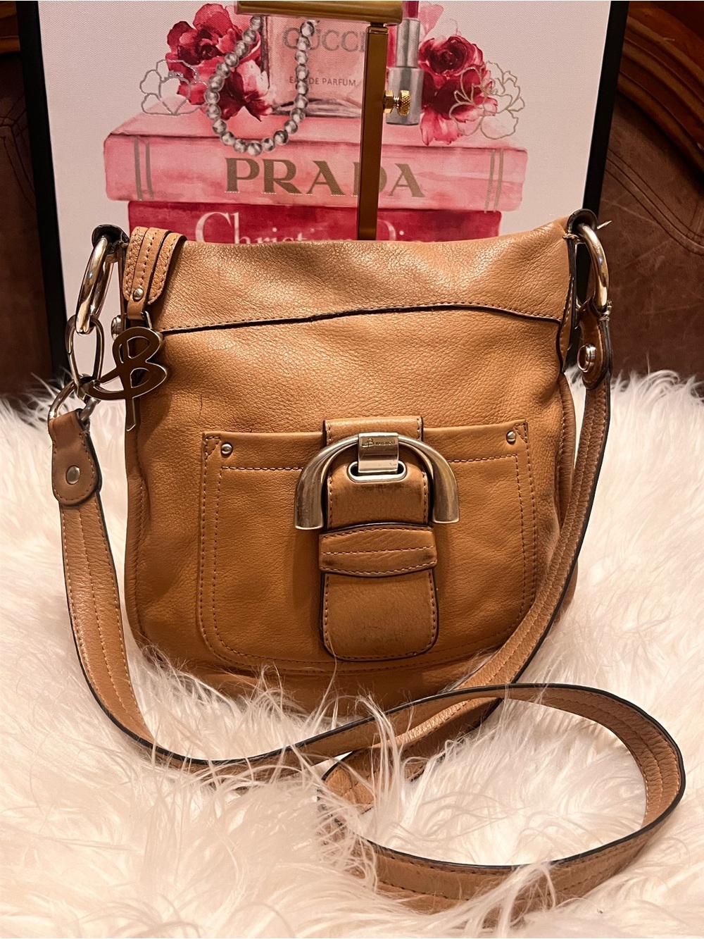 b. makowsky Tan Pebbled Leathe with Front Buckle and 'B' Charm crossbody bag